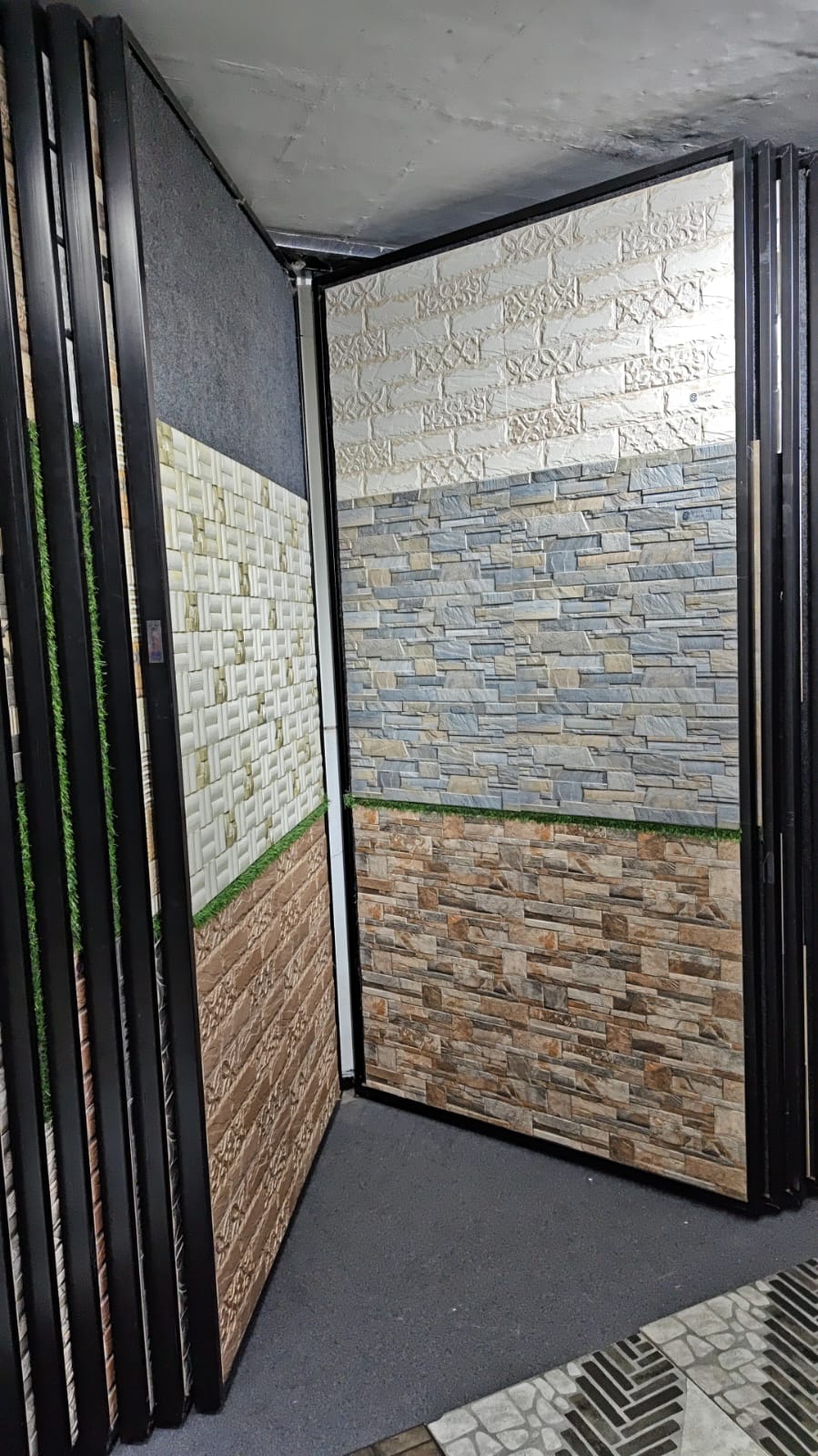 Imported stone-look cladding tiles displayed on showroom wall